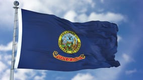 Wellenartig bewegende Flagge Idahos lizenzfreies stockfoto Wellenartig bewegende Flagge Idahos lizenzfreies stockfoto