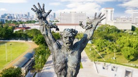 West Irian Liberation statue with skyscrapers