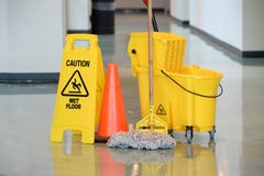 Wet Floor Sign With Mop stock image Wet Floor Sign With Mop stock image