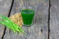 Wheat Grass Juice On Wood Background Royalty Free Stock Photo