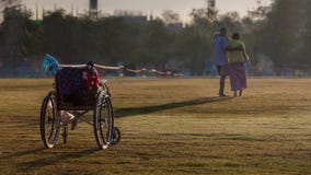 Wheelchair with handicap woman and her husband. stock photography Wheelchair with handicap woman and her husband. stock photography