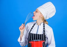 Whipping like pro. Girl in apron whipping eggs or cream. Start slowly whisking whipping or beating cream. Whipping cream royalty free stock images Whipping like pro. Girl in apron whipping eggs or cream. Start slowly whisking whipping or beating cream. Whipping cream royalty free stock images