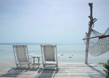 White Beach Chair And Hammock Facing Seascape Royalty Free Stock Photos