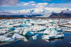 White-blue ice is piled up in the lagoon. Drift ice Ice Lagoon. Jokulsarlon. White-blue ice is piled up in the turquoise water of the lagoon Stock Photos White-blue ice is piled up in the lagoon. Drift ice Ice Lagoon. Jokulsarlon. White-blue ice is piled up in the turquoise water of the lagoon Stock Photos