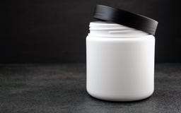 Facial mask and cream on marble table stock photo Facial mask and cream on marble table stock photo
