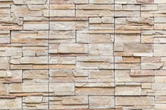 The white brown stone on concrete wall, textured wall background stock photography The white brown stone on concrete wall, textured wall background stock photography
