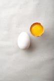 White chicken egg with one egg yolk Royalty Free Stock Image White chicken egg with one egg yolk Royalty Free Stock Image