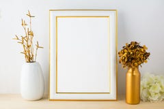 White fame mockup with white and golden vases Royalty Free Stock Images White fame mockup with white and golden vases Royalty Free Stock Images