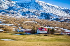 White farmhouse with bright red roof near Myvatn in Iceland stock photography White farmhouse with bright red roof near Myvatn in Iceland stock photography