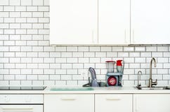 White interior design, modern and minimalist style kitchen with household appliances. Open space in living room full of stock image White interior design, modern and minimalist style kitchen with household appliances. Open space in living room full of stock image