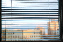 White jalousie at a window stock photos White jalousie at a window stock photos