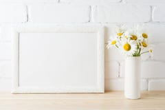 White landscape frame mockup with daisy flower in styled vase Stock Photo White landscape frame mockup with daisy flower in styled vase Stock Photo