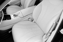 White leather interior of the luxury modern car. Leather comfortable white seats and multimedia. Steering wheel and dashboard. Aut royalty free stock images White leather interior of the luxury modern car. Leather comfortable white seats and multimedia. Steering wheel and dashboard. Aut royalty free stock images