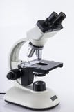 White microscope in laboratory against white background, close up royalty free stock photo White microscope in laboratory against white background, close up royalty free stock photo