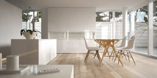 White Minimalist Interior With Dining Table Stock Photo
