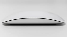 White multi-touch mouse shallow depth of field on white background. royalty free stock image White multi-touch mouse shallow depth of field on white background. royalty free stock image