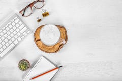 White office desk table with computer mouse and keyboard, cup of latte coffee, pencils and eye glasses. Top view with copy space, royalty free stock photos White office desk table with computer mouse and keyboard, cup of latte coffee, pencils and eye glasses. Top view with copy space, royalty free stock photos