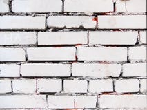 White old brick wall. Streaks red. royalty free stock photography White old brick wall. Streaks red. royalty free stock photography