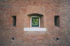 White painted wood arched window in a red brick wall . Royalty Free Stock Image White painted wood arched window in a red brick wall . Royalty Free Stock Image