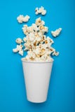 White paper cup with popcorn, mock up. Copy space stock images White paper cup with popcorn, mock up. Copy space stock images