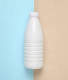 White plastic bottle of yogurt on a blue pink pastel background, stock images White plastic bottle of yogurt on a blue pink pastel background, stock images