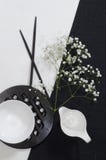 White Porcelain On Black And White Linen Tablecloths. Royalty Free Stock Photography
