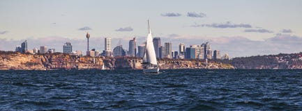 White Sailboat on Body of Water Near City Stock Images White Sailboat on Body of Water Near City Stock Images