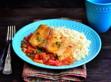 White Sea Fish Cooked In A Spicy Tomato Sauce With Sweet Pepper, Cumin, Garlic And Coriander. Stock Images