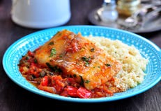 White Sea Fish Cooked In A Spicy Tomato Sauce With Sweet Pepper, Cumin, Garlic And Coriander. Royalty Free Stock Photos