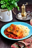 White Sea Fish Cooked In A Spicy Tomato Sauce With Sweet Pepper, Cumin, Garlic And Coriander. Stock Photo White Sea Fish Cooked In A Spicy Tomato Sauce With Sweet Pepper, Cumin, Garlic And Coriander. Stock Photo