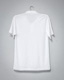 White shirt hanging on cement wall. Blank t-shirt for printing. Back view royalty free stock photography White shirt hanging on cement wall. Blank t-shirt for printing. Back view royalty free stock photography