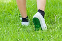 White Sneaker With Step On Grassland Stock Photography White Sneaker With Step On Grassland Stock Photography