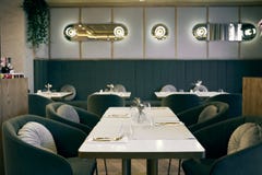 White Table And Armchairs With Cushions In Restaurant Stock Photo White Table And Armchairs With Cushions In Restaurant Stock Photo