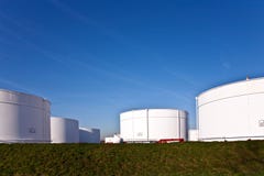 White Tanks In Tank Farm With Blue Sky Stock Images White Tanks In Tank Farm With Blue Sky Stock Images