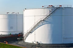 White Tanks In Tank Farm With Blue Sky Stock Photo White Tanks In Tank Farm With Blue Sky Stock Photo