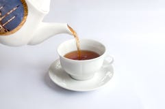 White tea cup with red tea stock photo White tea cup with red tea stock photo