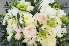 White Wedding Bouquet Roses Pink flowers and Ruscus Leaves with Robbons on Gray Asphalt Background. Wedding Decoration stock photos White Wedding Bouquet Roses Pink flowers and Ruscus Leaves with Robbons on Gray Asphalt Background. Wedding Decoration stock photos