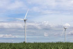 White wind turbines alternative renewable energy from nature in wind power station under blue sky backgroun royalty free stock image White wind turbines alternative renewable energy from nature in wind power station under blue sky backgroun royalty free stock image