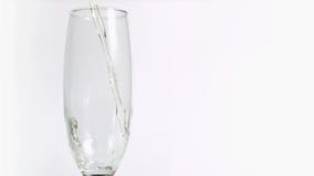 White wine splashing in super slow motion in a flute