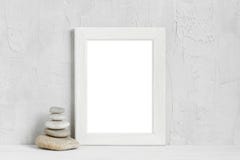 White wooden empty frame and sea stones royalty free stock images White wooden empty frame and sea stones royalty free stock images