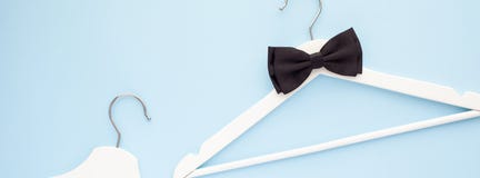 White wooden hangers on blue background royalty free stock photos White wooden hangers on blue background royalty free stock photos