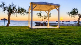 White wooden shed. At seashore during sunrise Stock Images White wooden shed. At seashore during sunrise Stock Images