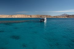 White yacht in the Red sea with blue water. Reef for snorkeling Stock Images White yacht in the Red sea with blue water. Reef for snorkeling Stock Images