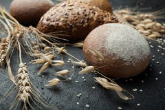 Whole Grain rye gluten free bread with seeds on a black board stock photos Whole Grain rye gluten free bread with seeds on a black board stock photos