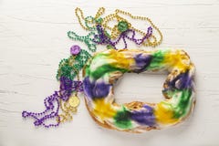 Whole King Cake with Mardi Gras Beads stock photos Whole King Cake with Mardi Gras Beads stock photos