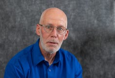 Wicked man, portrait of a man with the pursed lips looking straight into camera royalty free stock image Wicked man, portrait of a man with the pursed lips looking straight into camera royalty free stock image