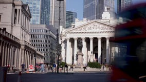 Wide-angle footage looking up at the London financial landmarks of the Royal Exchange and Bank of England. Brexit: Bank