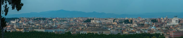 Wide dusk urban skyline panorama of Rome with main architectural international landmarks from Janiculum hill viewpoint Royalty Free Stock Photography Wide dusk urban skyline panorama of Rome with main architectural international landmarks from Janiculum hill viewpoint Royalty Free Stock Photography