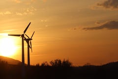 Wind power station in sunset. Romantic evening and modern technologies of ecologically clean electricity. Protection of the enviro royalty free stock photography Wind power station in sunset. Romantic evening and modern technologies of ecologically clean electricity. Protection of the enviro royalty free stock photography