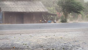 Wind storm blown dust and leaves on road Royalty Free Stock Photo Wind storm blown dust and leaves on road Royalty Free Stock Photo